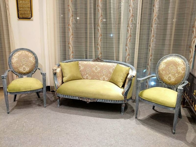 Two-seat sofa and armchairs with painted frames and woven patterned fabric