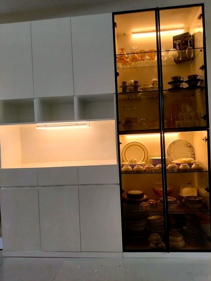 Kitchen with a glass display cabinet lit from inside