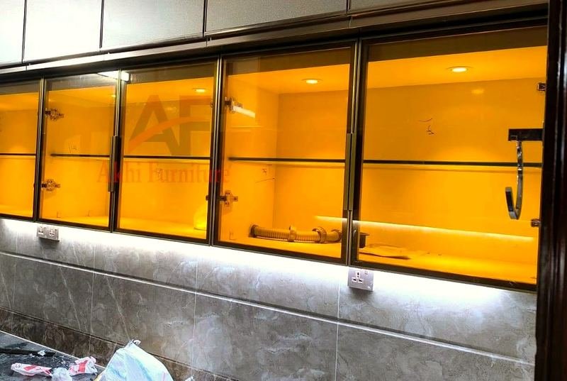 Kitchen cabinets with a glass-front cabinet lit from inside