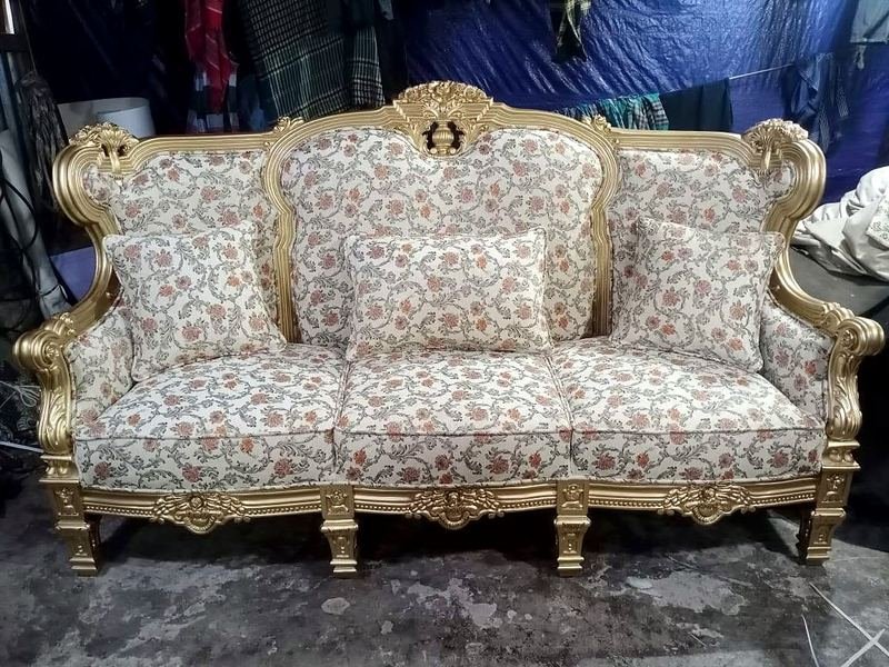 Gold carved sofa in the workshop